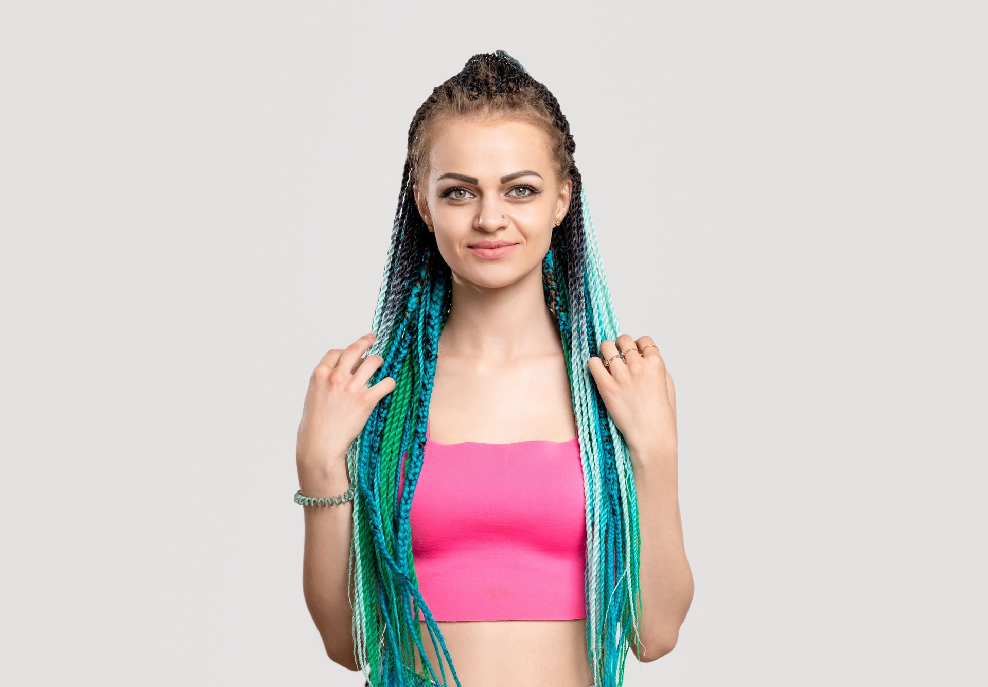 woman blue braids colorful hair ethnic hairstyle